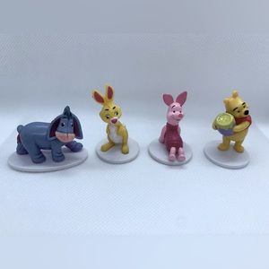 Collection of Winnie the Pooh Figurines